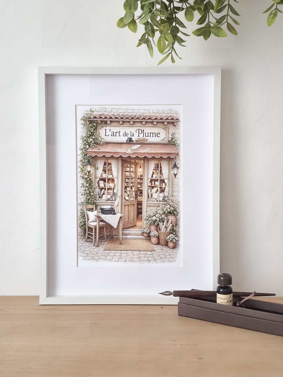 Affiche illustrée A4 Vitrine papeterie L'Art de la Plume mise en situation. Impression hd sur carton 200 g
